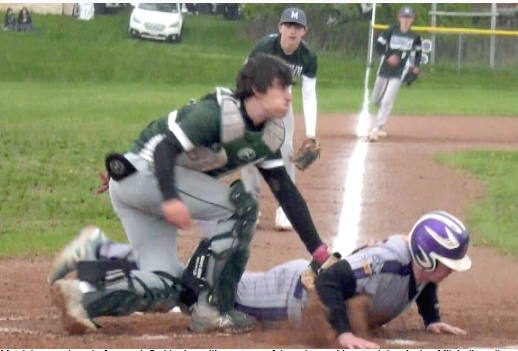  Aydan Mitchell applies the tag. 